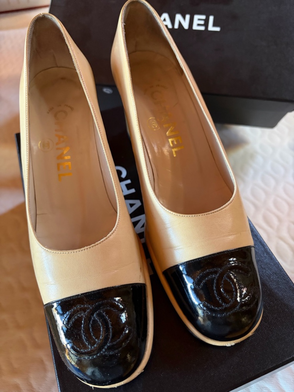 CHANEL Cream Leather Flats with Black Patent Cap Toe and CC Logo